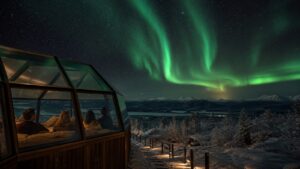 Night-sky scene illustrating destination selection based on geomagnetic latitude, climate, access, terrain, and backup activities rather than reputation alone