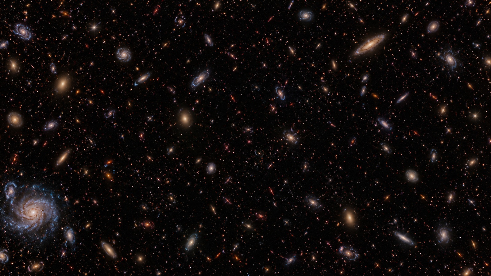 Illustrative deep galaxy field continuing beyond the frame, with tiny remote red galaxies and a small blue spiral near one corner.