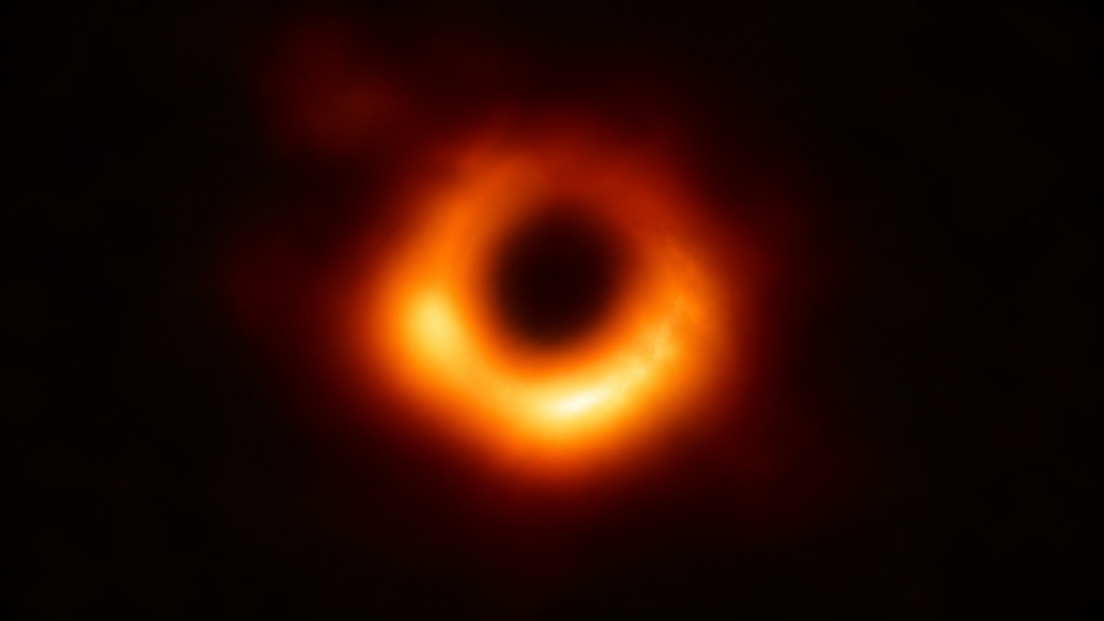 Editorial illustration of an uneven orange emission ring surrounding a dark black hole shadow, inspired by observations of M87.